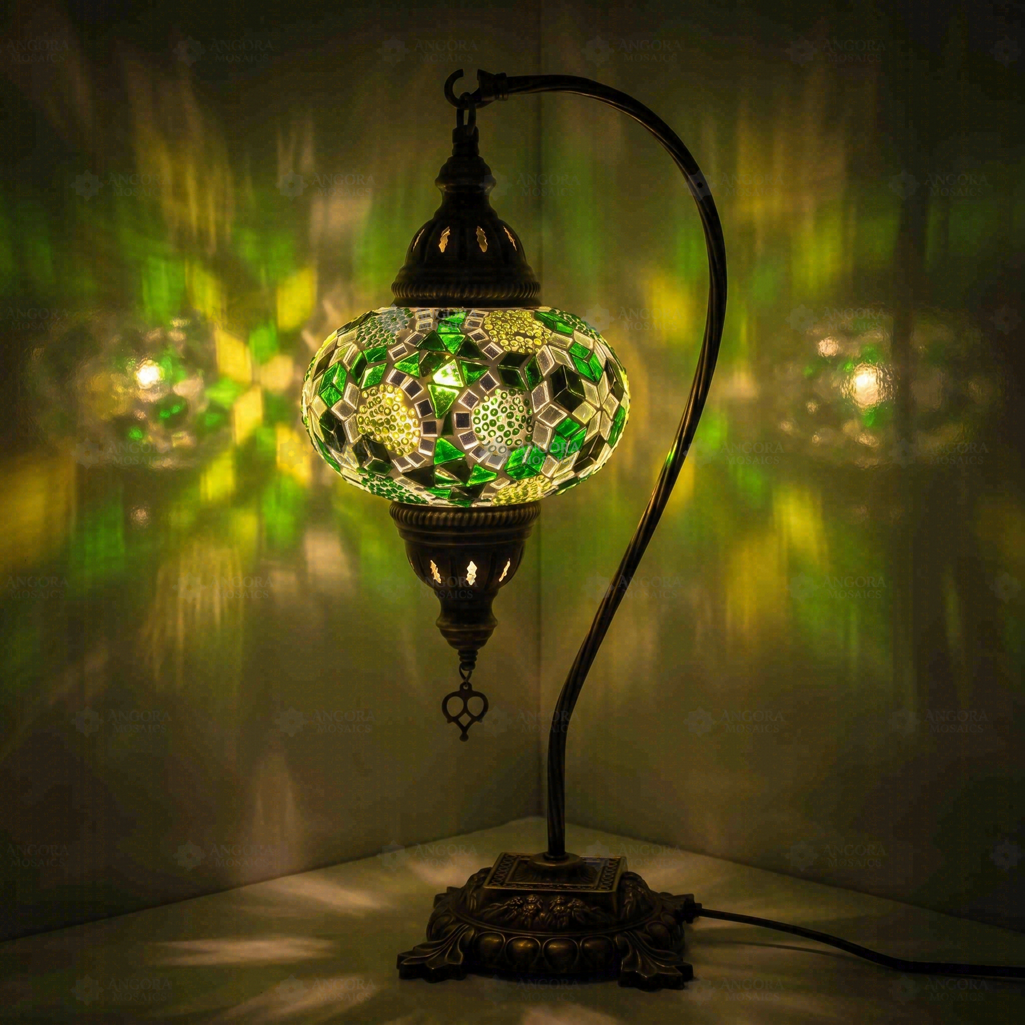 Green Turkish mosaic table lamp illuminated, showing colorful light projection (ENV DVN3100)