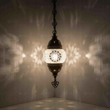 White Turkish mosaic pendant light illuminated, showing colorful light projection (ENV DYN1001)