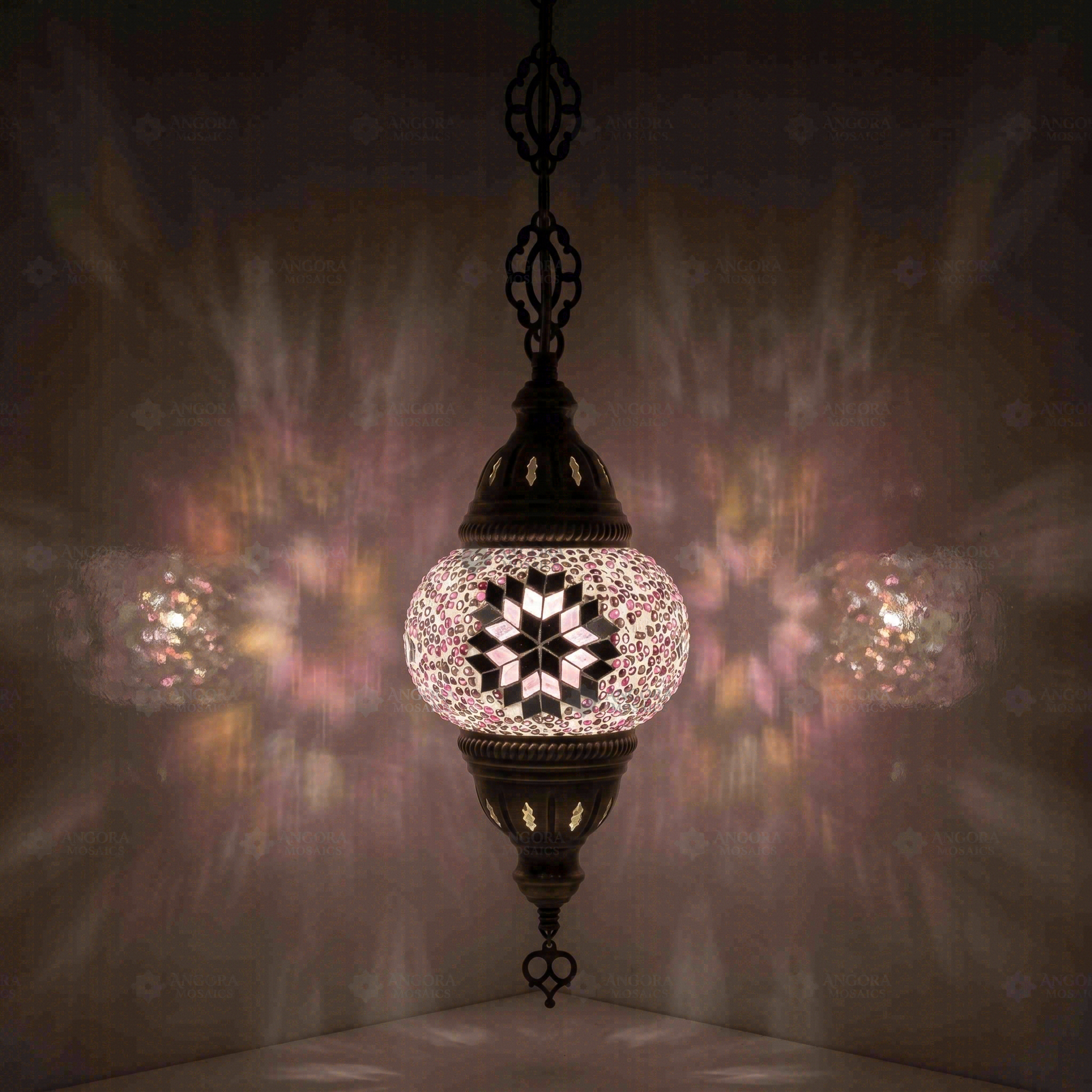 Pink Turkish mosaic pendant light illuminated, showing colorful light projection (ENV DYN1034)