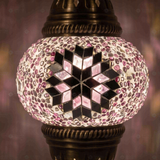 Lit close-up of mosaic glass globe — Pink pendant light glowing (ENV DYN1034)