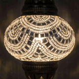 Lit close-up of mosaic glass globe — White pendant light glowing (ENV DYN2001)
