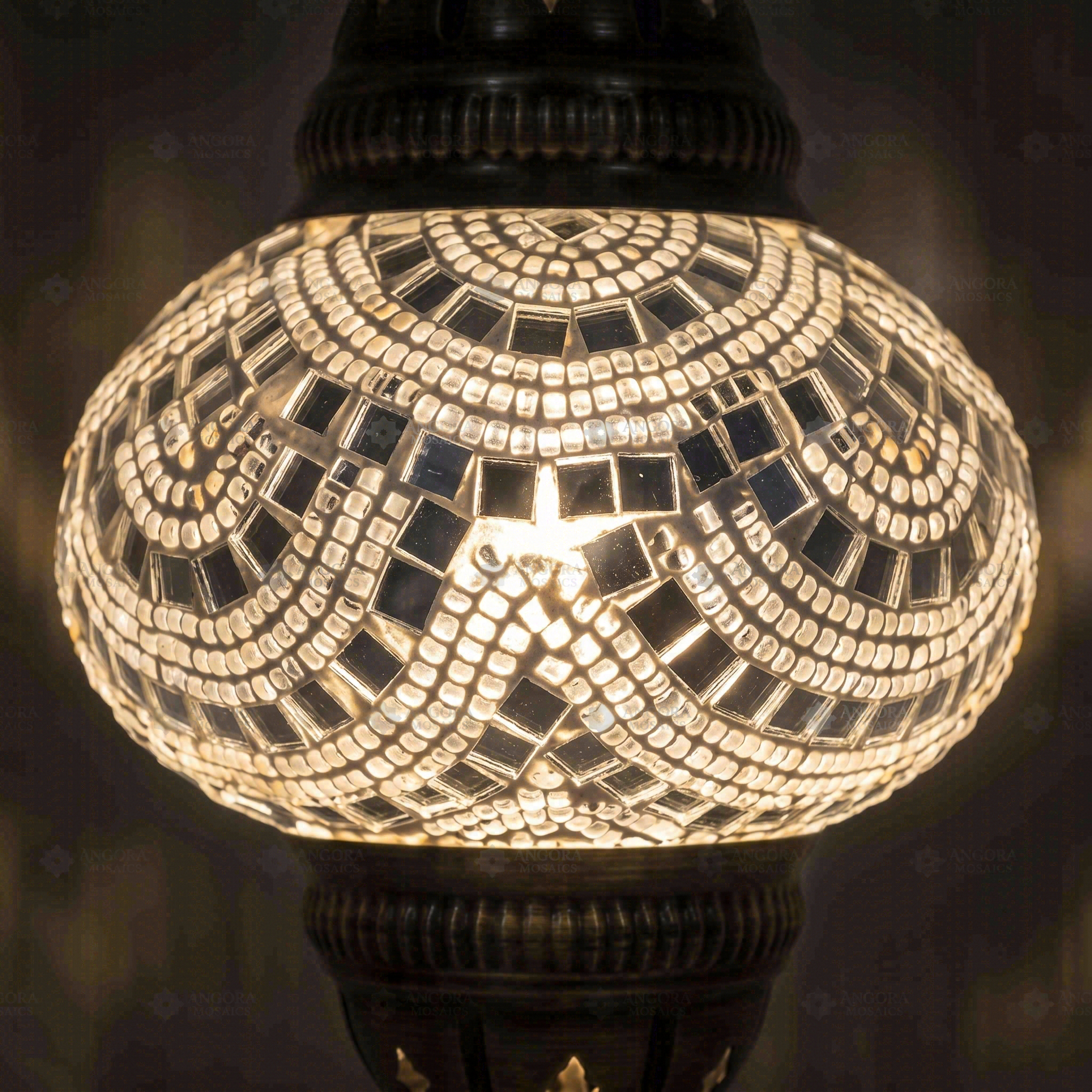 Lit close-up of mosaic glass globe — White pendant light glowing (ENV DYN2001)