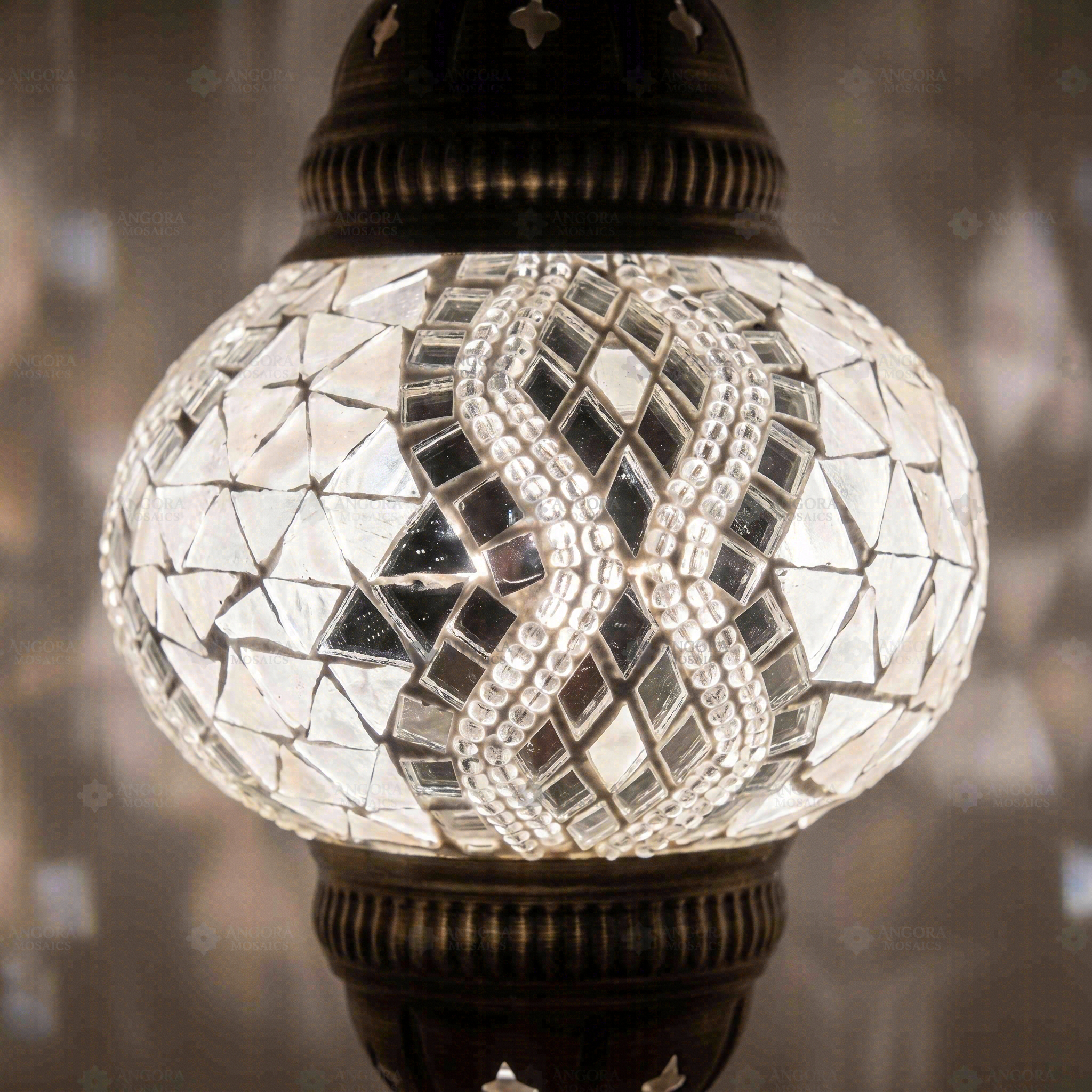 Lit close-up of mosaic glass globe — White pendant light glowing (ENV DYN2017)
