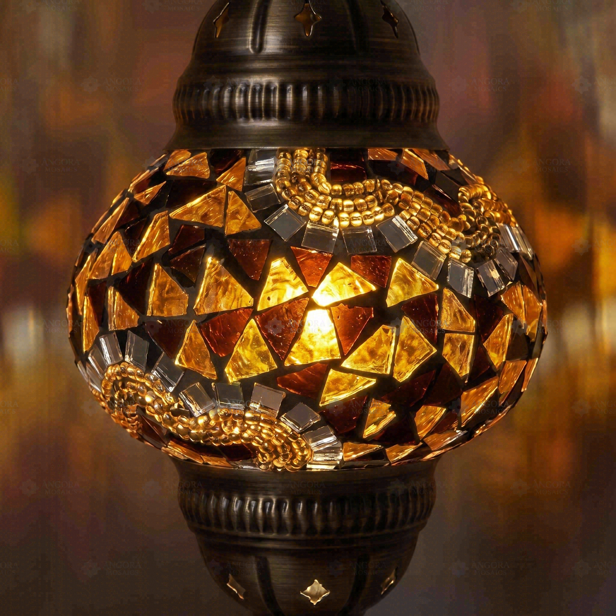 Lit close-up of mosaic glass globe — Amber pendant light glowing (ENV DYN2079)