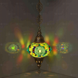 Green Turkish mosaic pendant light illuminated, showing colorful light projection (ENV DYN3006)
