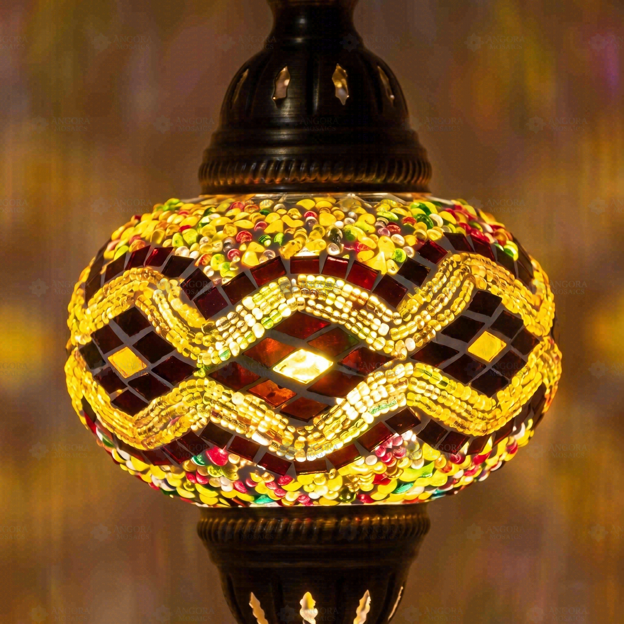 Lit close-up of mosaic glass globe — Amber pendant light glowing (ENV DYN3013)