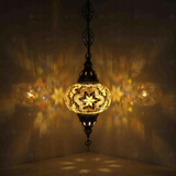 White Turkish mosaic pendant light illuminated, showing colorful light projection (ENV DYN3015)