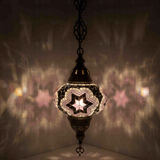 Pink Turkish mosaic pendant light illuminated, showing colorful light projection (ENV DYN3019)