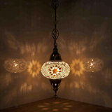 White Turkish mosaic pendant light illuminated, showing colorful light projection (ENV DYN3022)