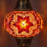Lit close-up of mosaic glass globe — Amber pendant light glowing (ENV DYN3025)