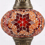 Close-up of Amber warm amber mosaic glass globe pattern — pendant light (ENV DYN3025)