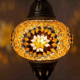 Lit close-up of mosaic glass globe — Amber pendant light glowing (ENV DYN3026)