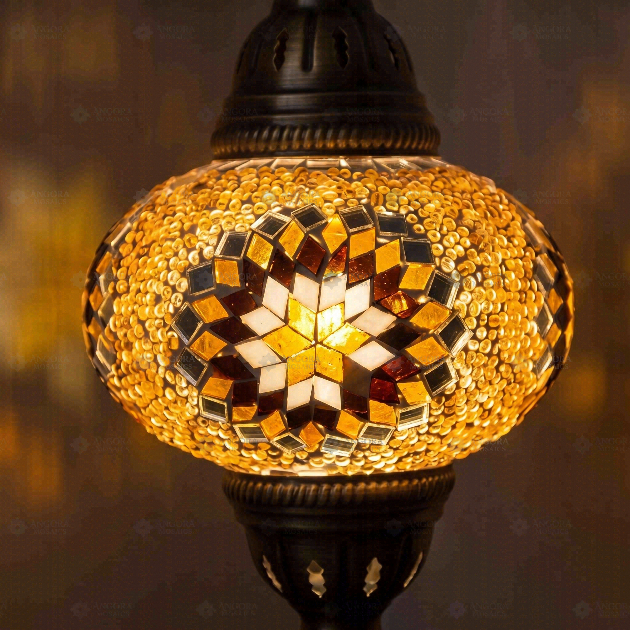 Lit close-up of mosaic glass globe — Amber pendant light glowing (ENV DYN3026)