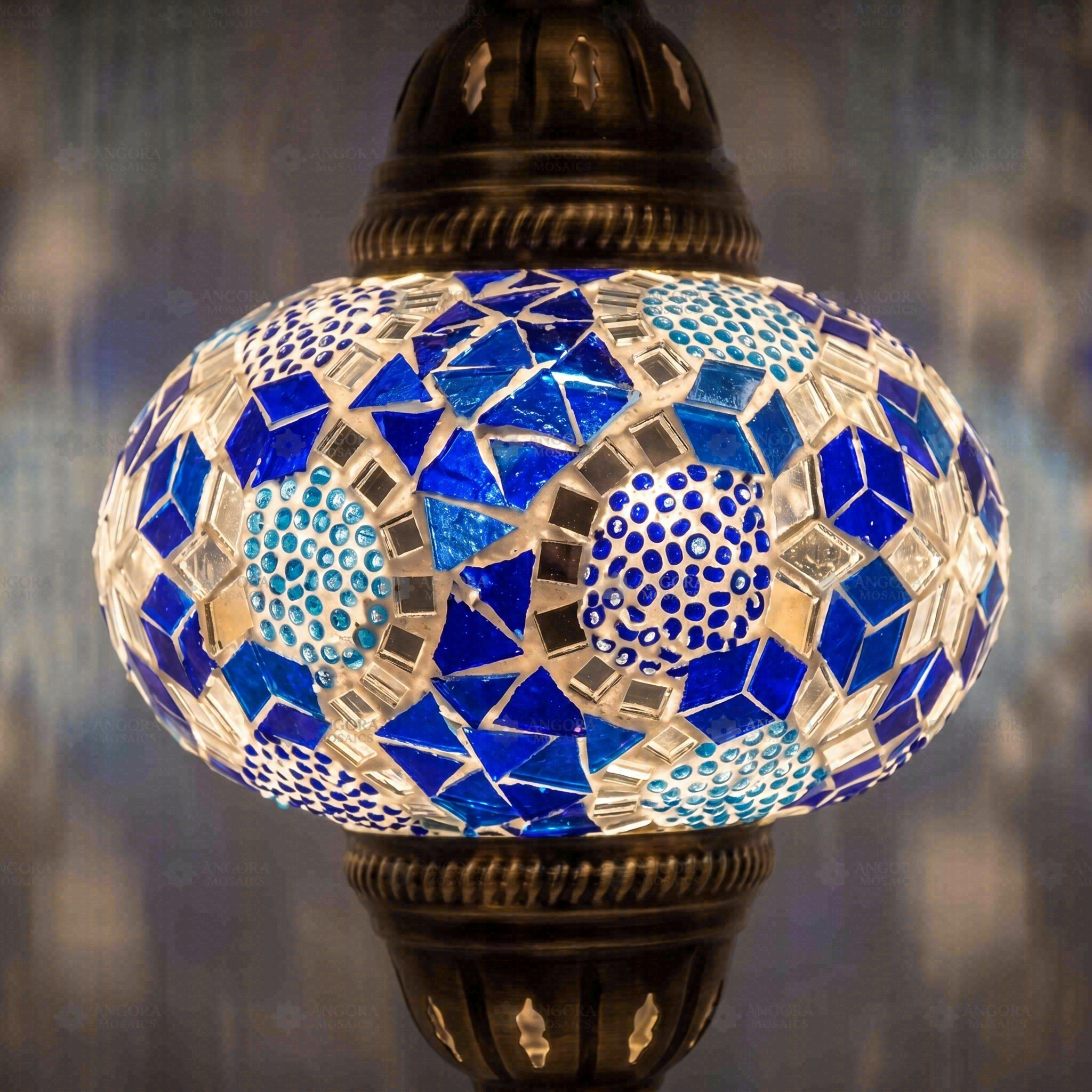 Lit close-up of mosaic glass globe — Blue pendant light glowing (ENV DYN3028)