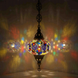 Multicolor Turkish mosaic pendant light illuminated, showing colorful light projection (ENV DYN3029)