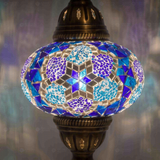 Lit close-up of mosaic glass globe — Blue pendant light glowing (ENV DYN3034)