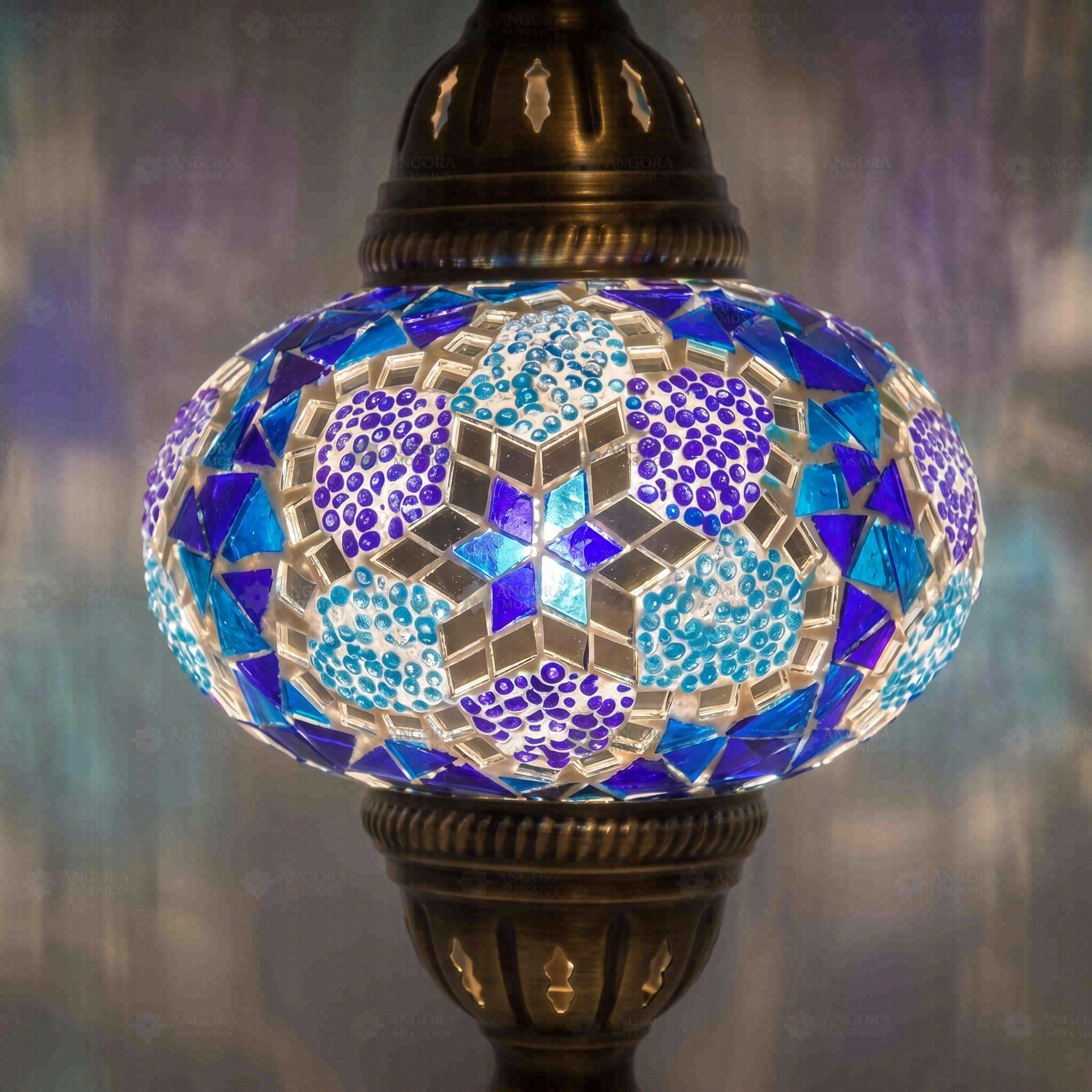 Lit close-up of mosaic glass globe — Blue pendant light glowing (ENV DYN3034)