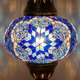 Lit close-up of mosaic glass globe — Blue pendant light glowing (ENV DYN3039)