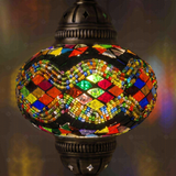 Lit close-up of mosaic glass globe — Multicolor pendant light glowing (ENV DYN3047)