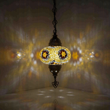 Amber Turkish mosaic pendant light illuminated, showing colorful light projection (ENV DYN3049)
