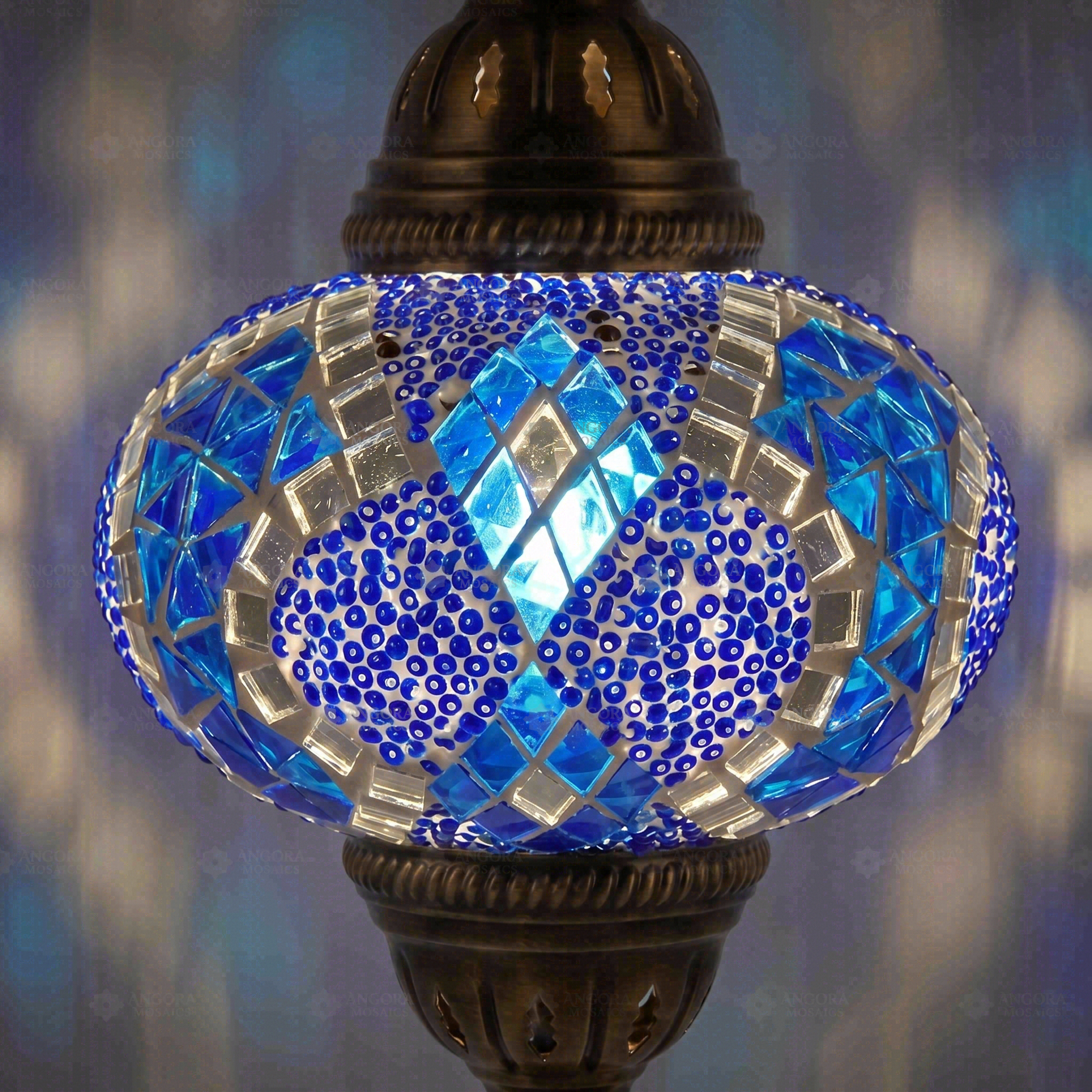 Lit close-up of mosaic glass globe — Blue pendant light glowing (ENV DYN3053)
