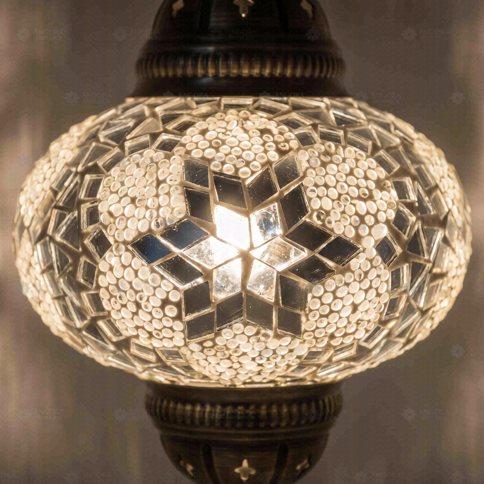 Lit close-up of mosaic glass globe — White pendant light glowing (ENV DYN3054)