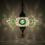 Green Turkish mosaic pendant light illuminated, showing colorful light projection (ENV DYN3055)