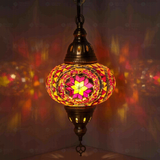 Amber Turkish mosaic pendant light illuminated, showing colorful light projection (ENV DYN3056)