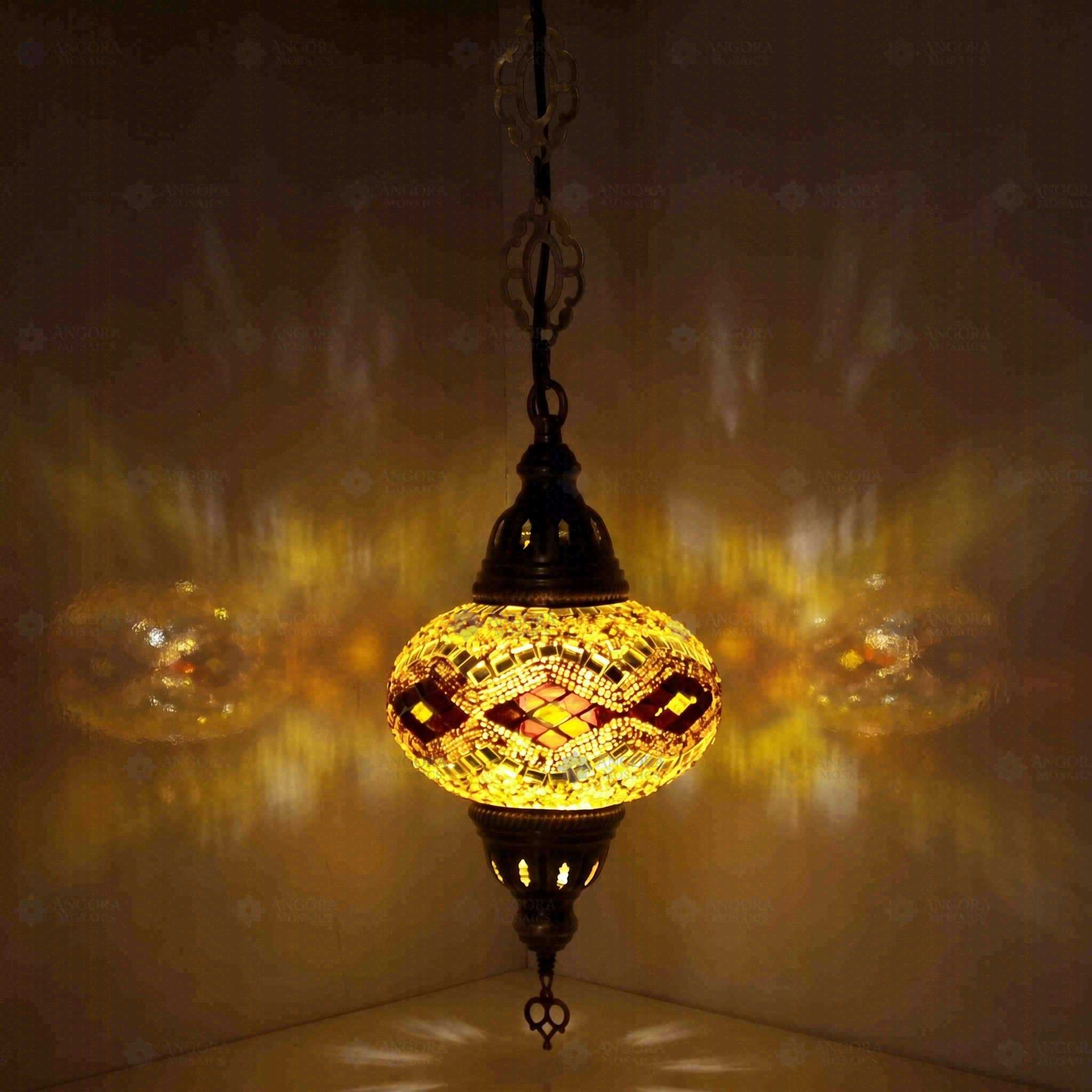 Amber Turkish mosaic pendant light illuminated, showing colorful light projection (ENV DYN3057)