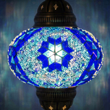 Lit close-up of mosaic glass globe — Blue pendant light glowing (ENV DYN3058)