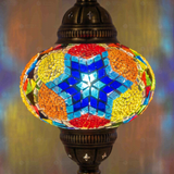 Lit close-up of mosaic glass globe — Multicolor pendant light glowing (ENV DYN3061)