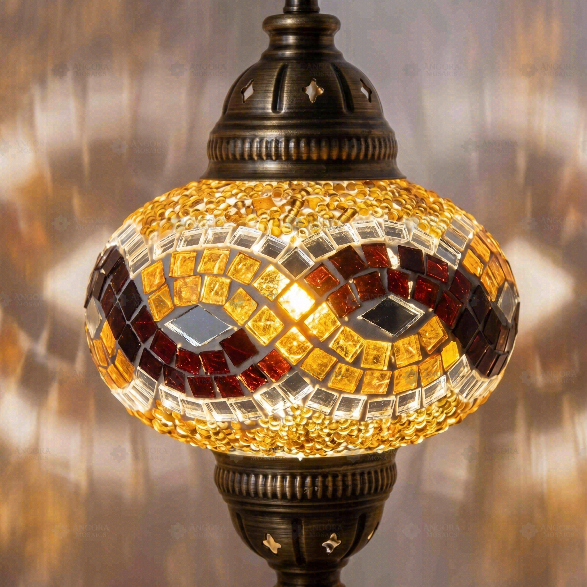 Lit close-up of mosaic glass globe — Amber pendant light glowing (ENV DYN3064)