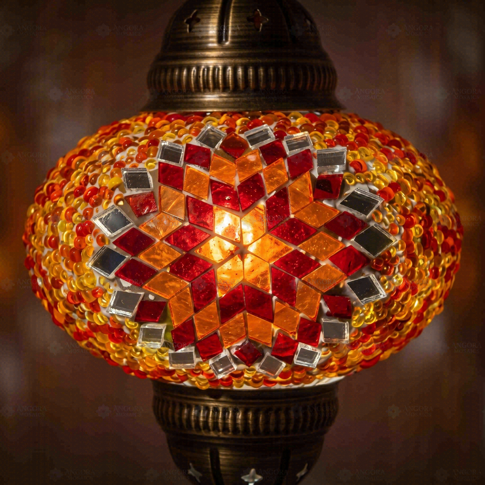 Lit close-up of mosaic glass globe — Amber pendant light glowing (ENV DYN3065)