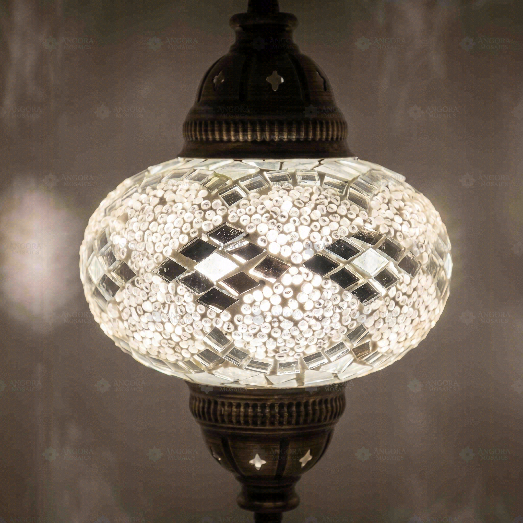 Lit close-up of mosaic glass globe — White pendant light glowing (ENV DYN3068)