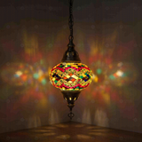 Multicolor Turkish mosaic pendant light illuminated, showing colorful light projection (ENV DYN3074)