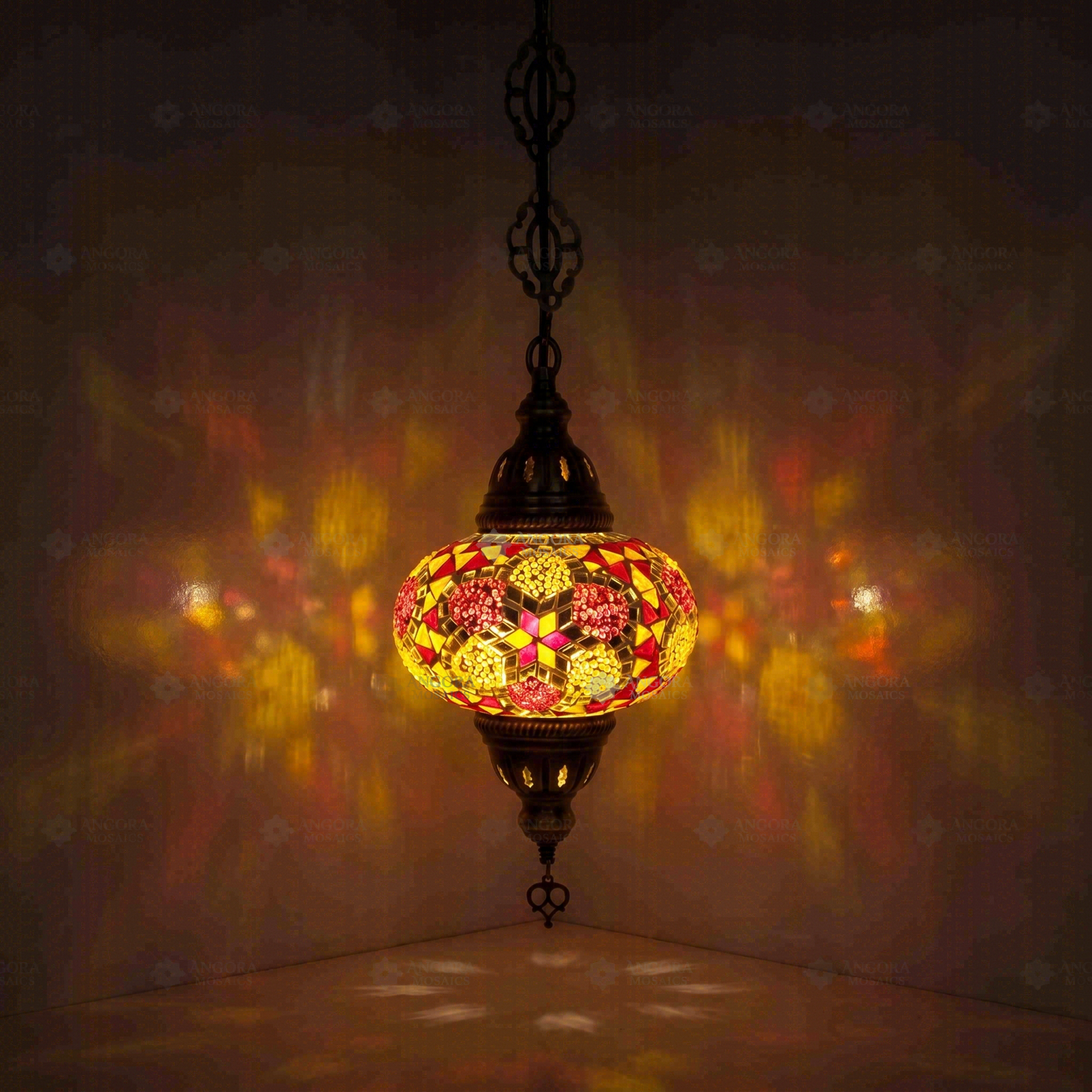 Amber Turkish mosaic pendant light illuminated, showing colorful light projection (ENV DYN3079)