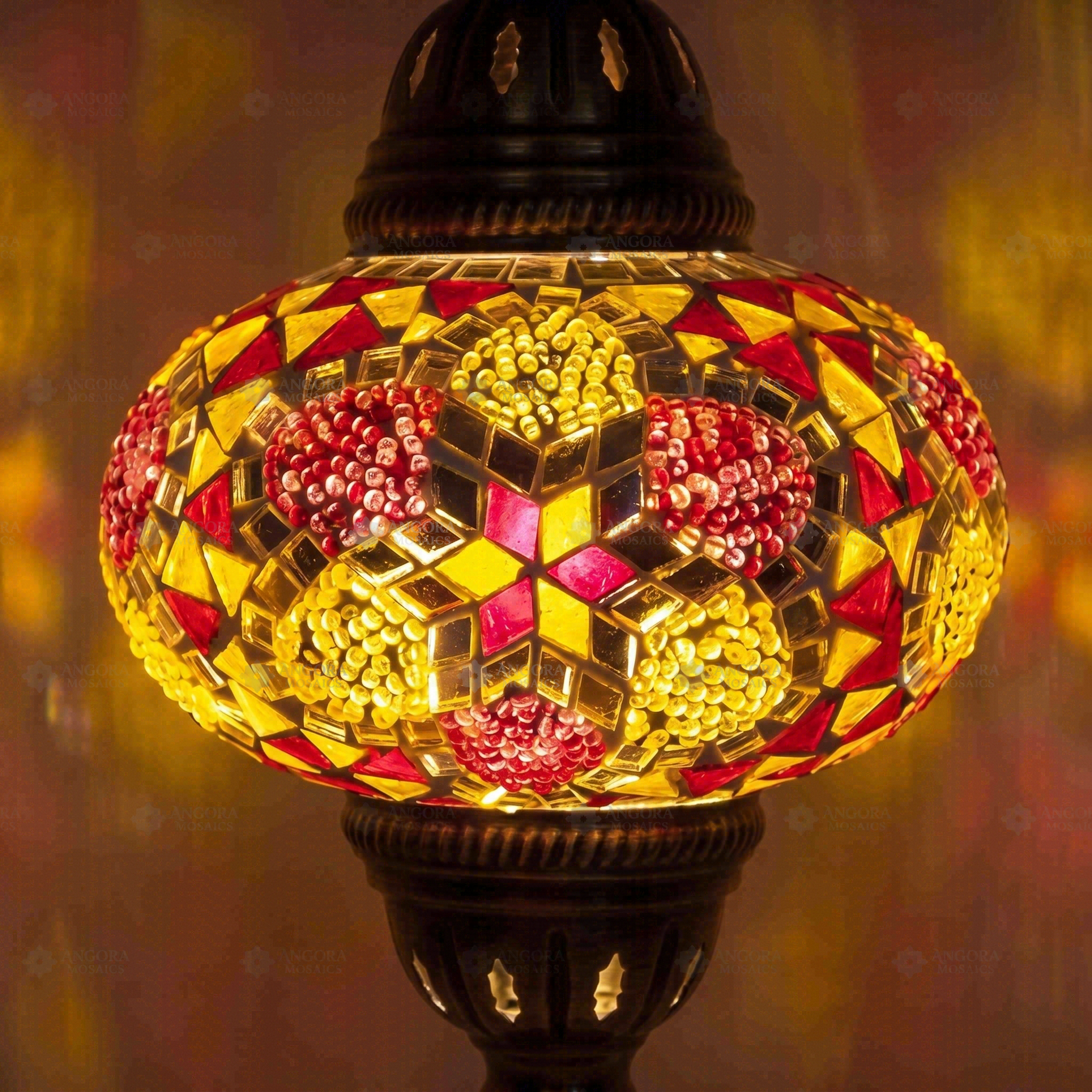Lit close-up of mosaic glass globe — Amber pendant light glowing (ENV DYN3079)