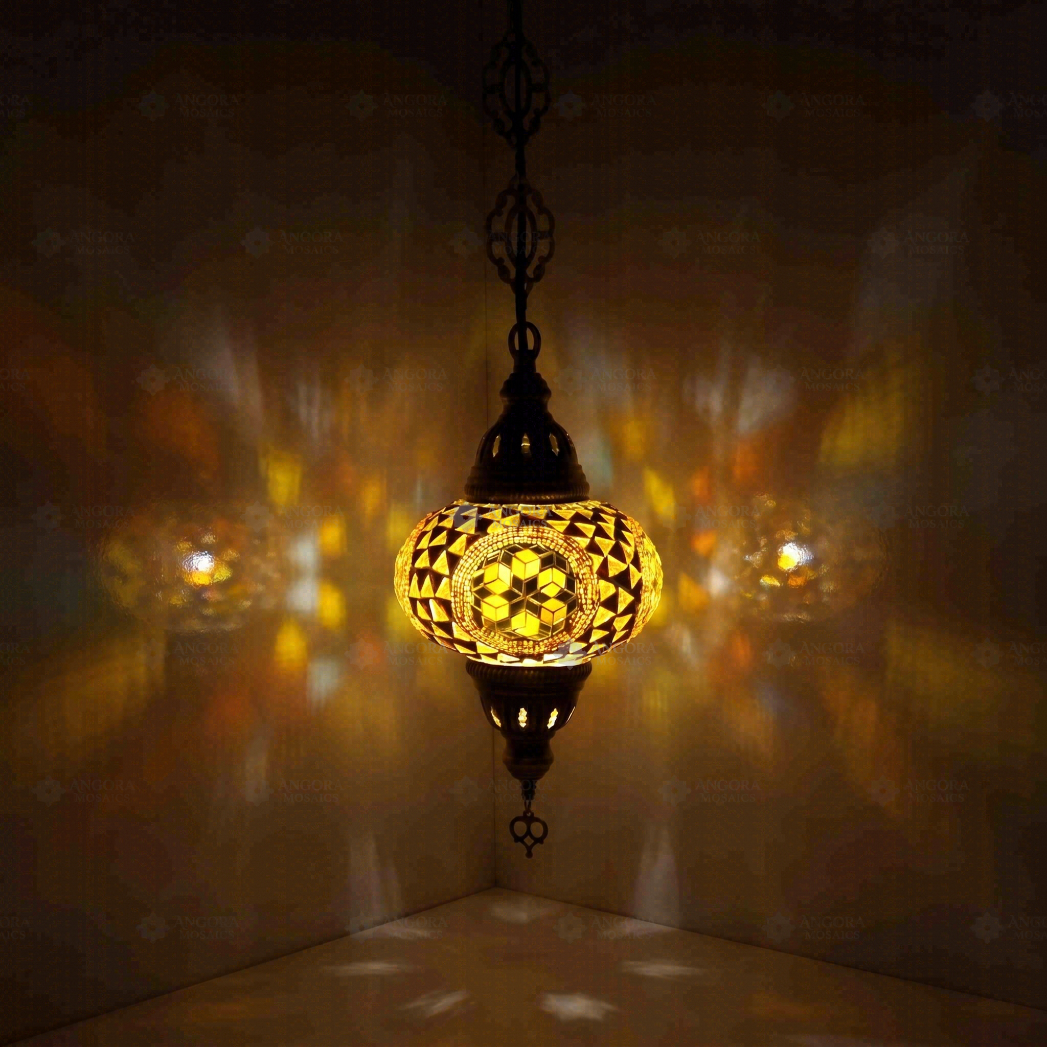 Amber Turkish mosaic pendant light illuminated, showing colorful light projection (ENV DYN3089)