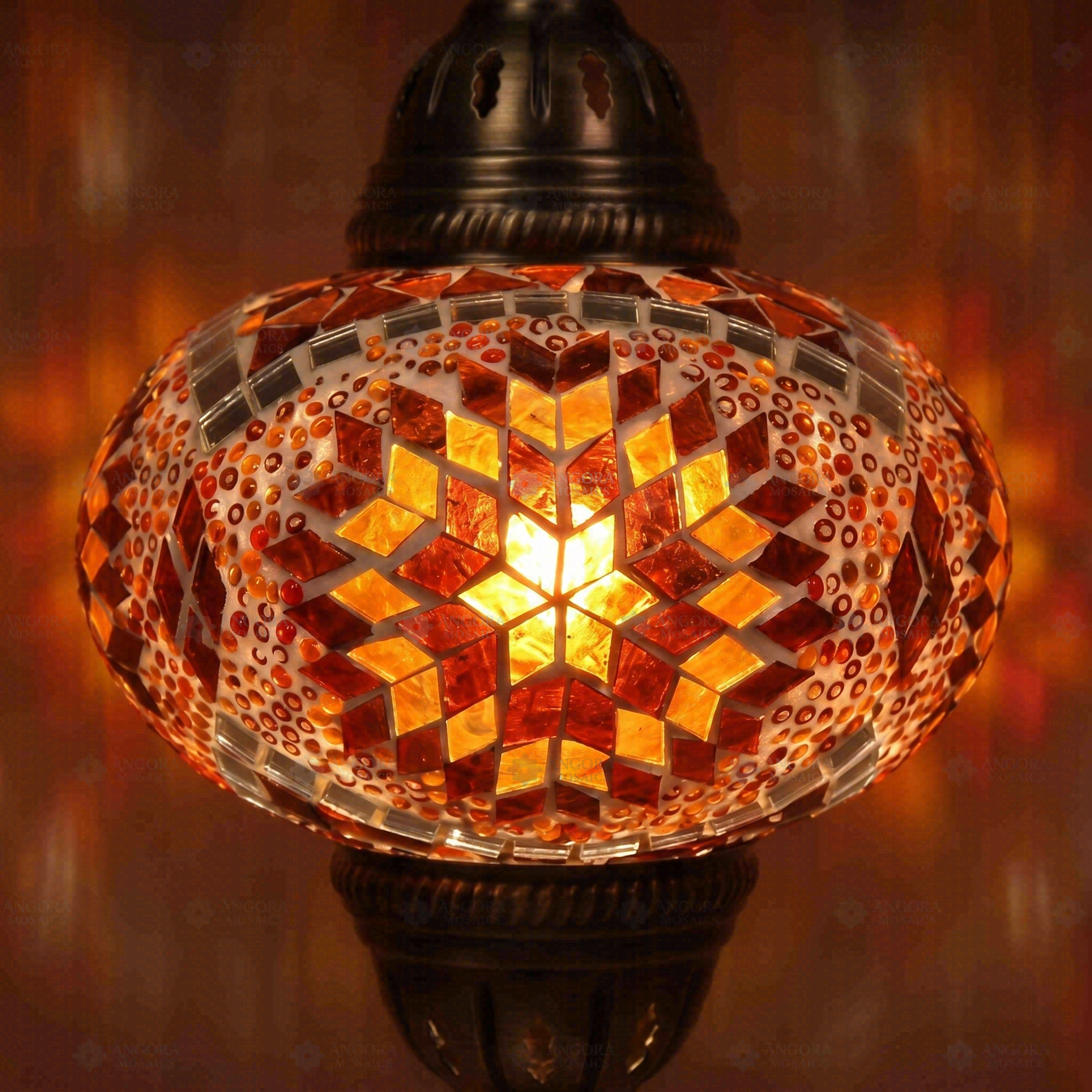 Lit close-up of mosaic glass globe — Amber pendant light glowing (ENV DYN3090)