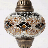 Close-up of Amber warm amber mosaic glass globe pattern — pendant light (ENV DYN3092)