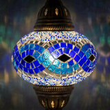 Lit close-up of mosaic glass globe — Blue pendant light glowing (ENV DYN3094)