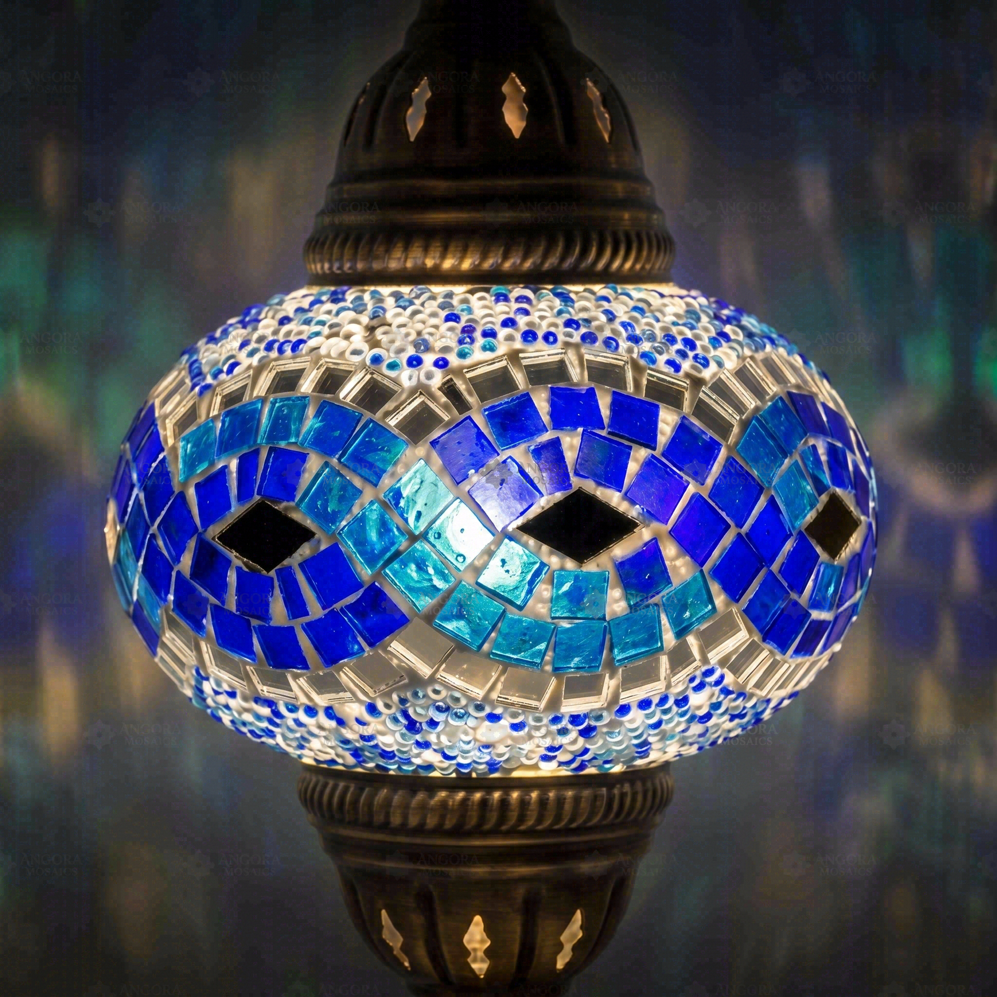 Lit close-up of mosaic glass globe — Blue pendant light glowing (ENV DYN3094)