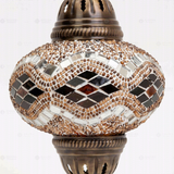 Close-up of Amber warm amber mosaic glass globe pattern — pendant light (ENV DYN3097)