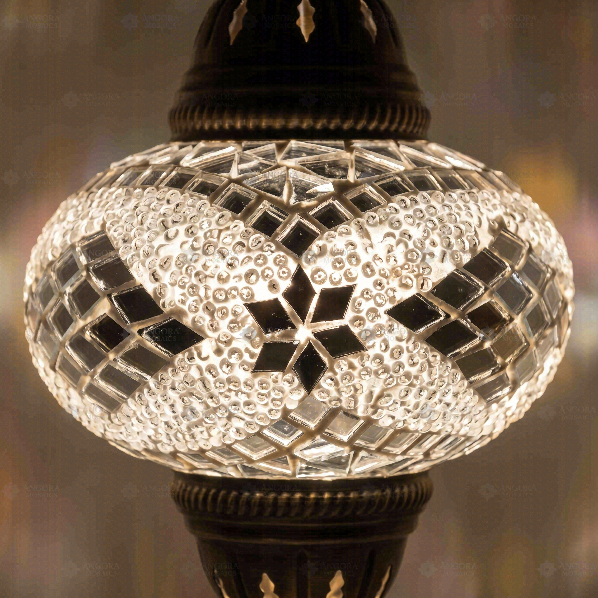 Lit close-up of mosaic glass globe — White pendant light glowing (ENV DYN3098)