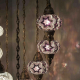 Lit close-up of mosaic glass globe — Cool Tones chandelier glowing (ENV HLZ10N3 (3019X5-3043X5))