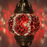 Lit close-up of mosaic glass globe — Red table lamp glowing (ENV MUN1003)