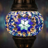 Lit close-up of mosaic glass globe — Blue table lamp glowing (ENV MUN1014)