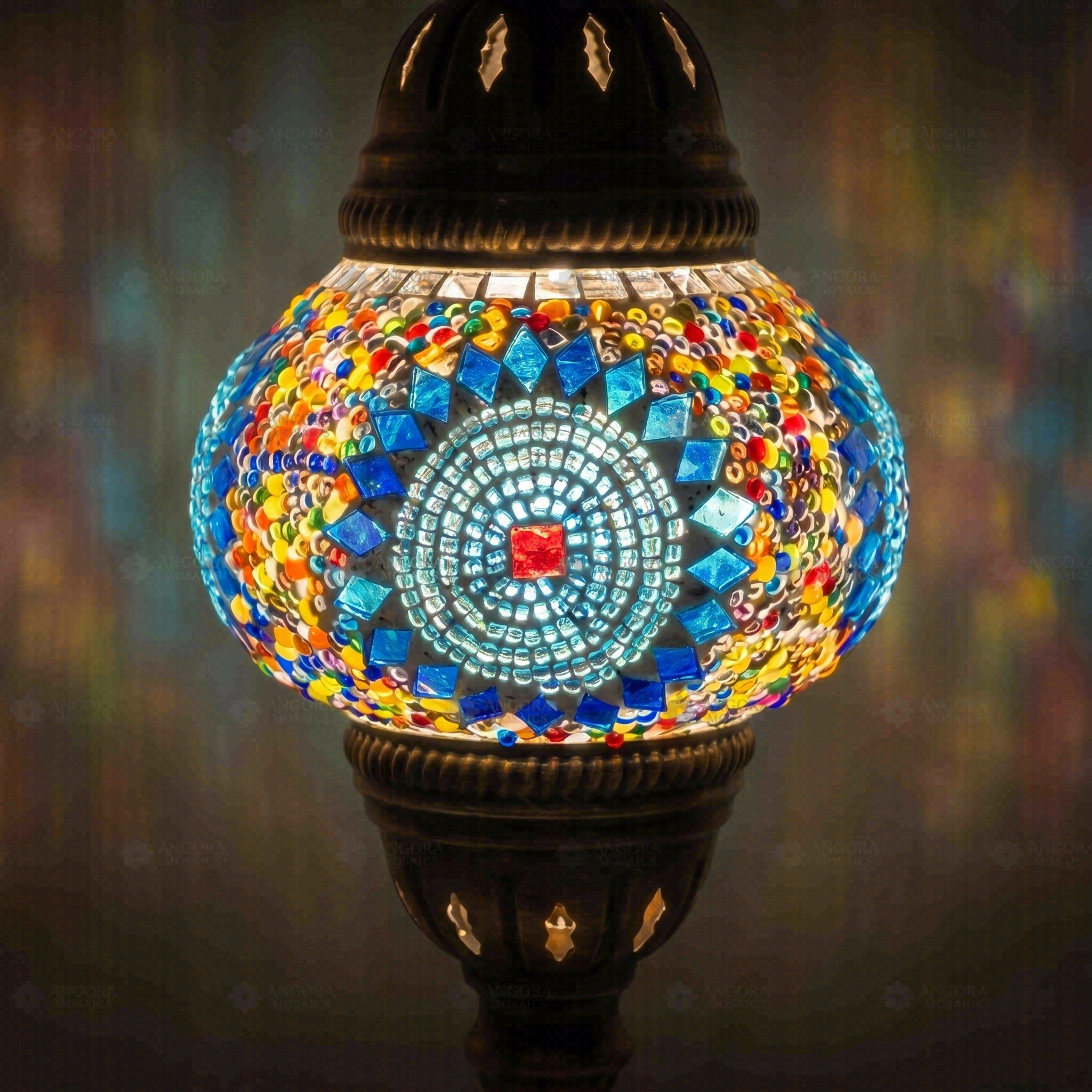Lit close-up of mosaic glass globe — Blue table lamp glowing (ENV MUN2010)
