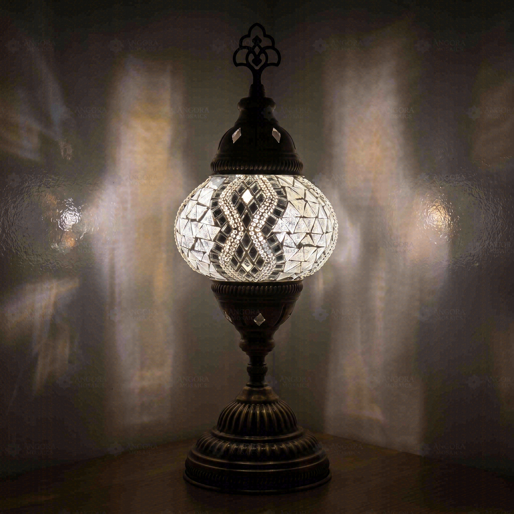 White Turkish mosaic table lamp illuminated, showing colorful light projection (ENV MUN2017)