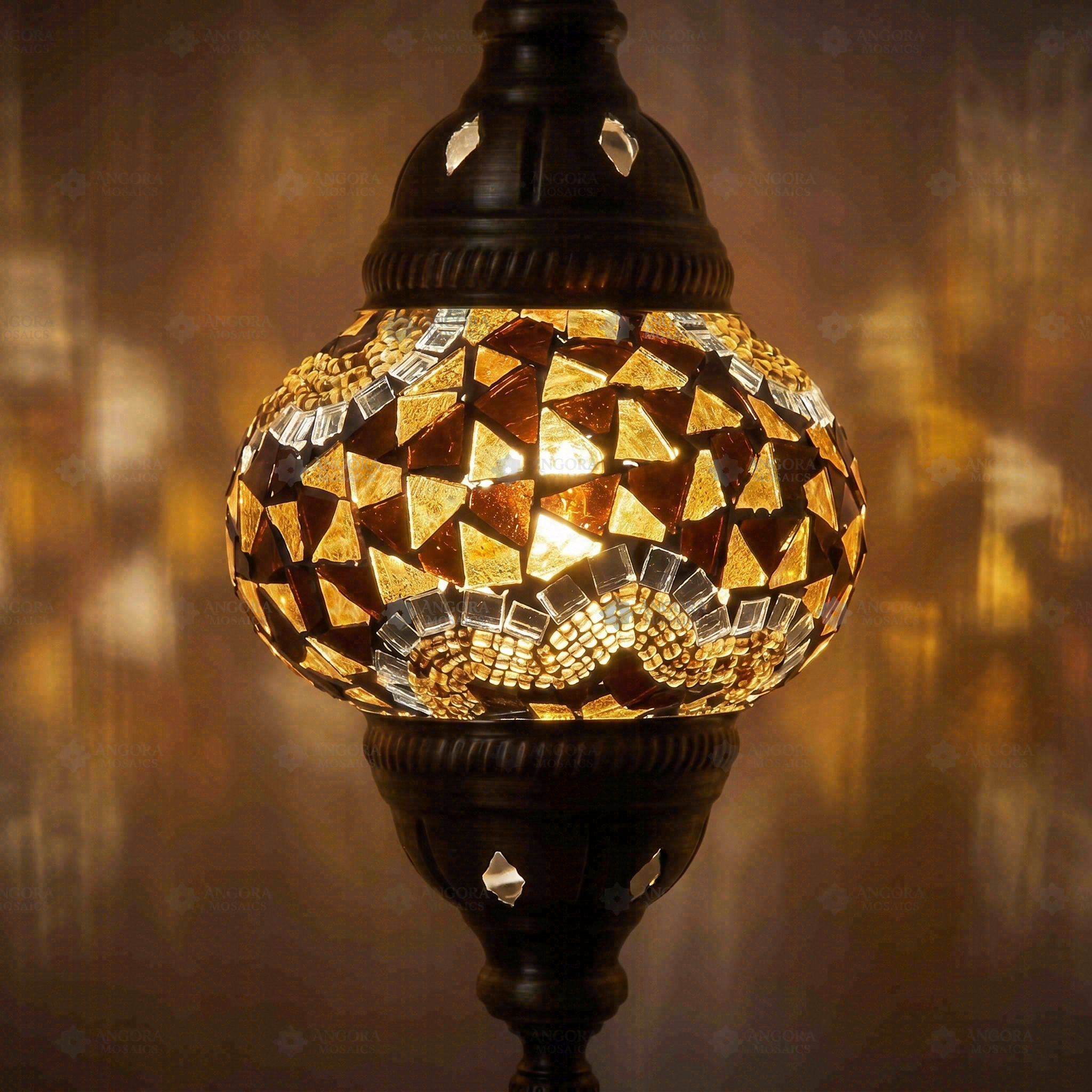 Lit close-up of mosaic glass globe — Amber table lamp glowing (ENV MUN2079)